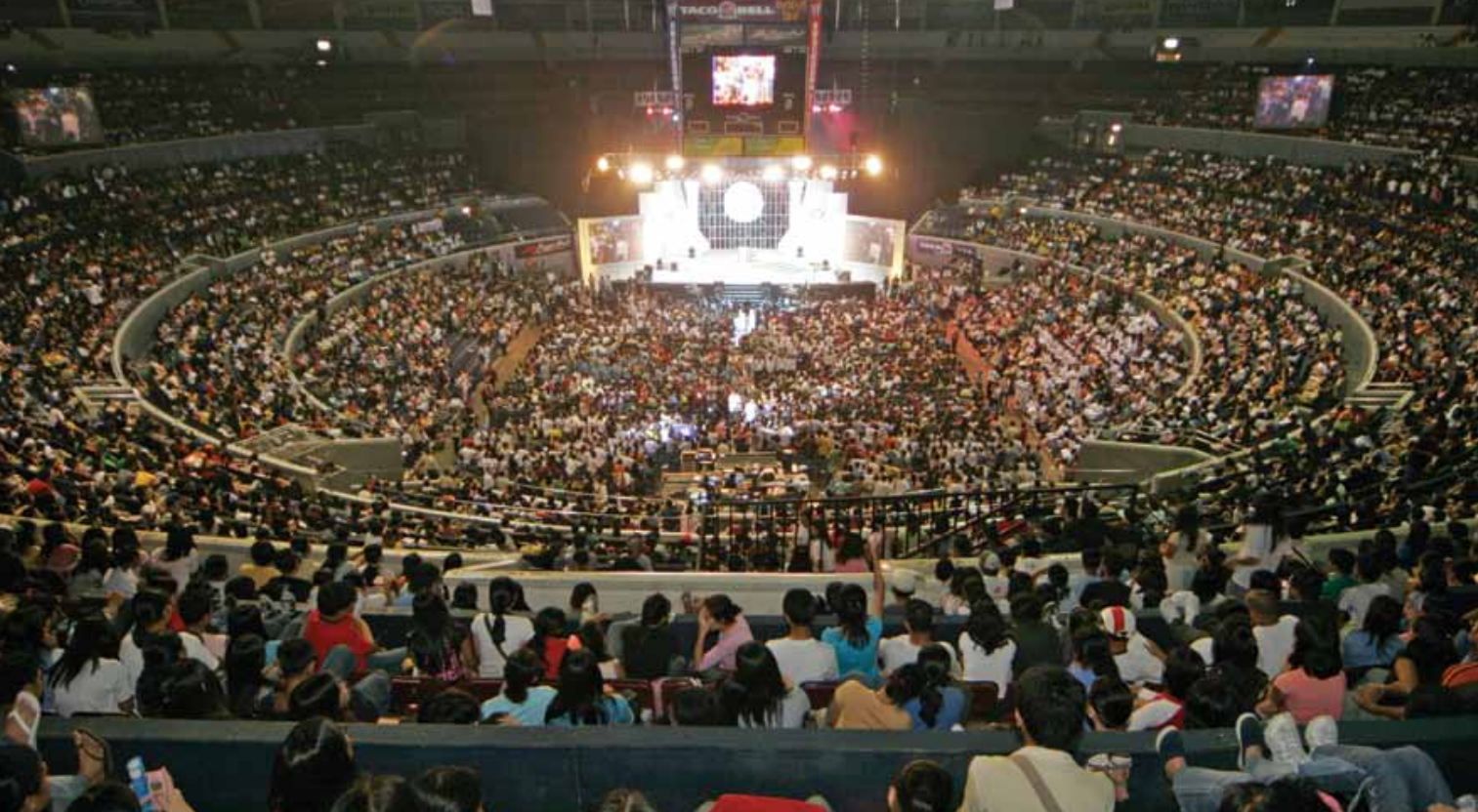 Large collegiate and university student assembly at Araneta Coliseum